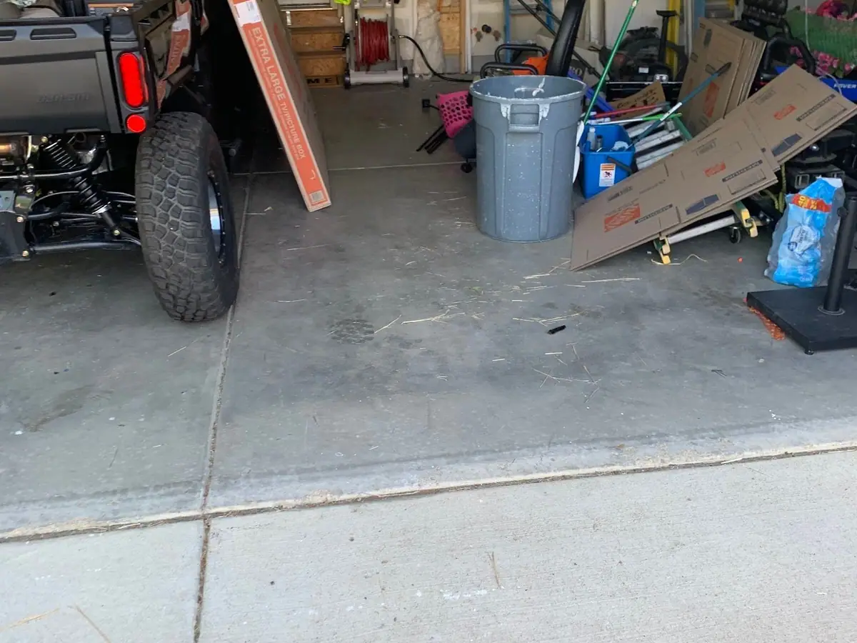 The same garage with the crib gone and the floor clear